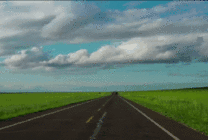 开车行驶在草原上的公路上漫天的白云gif图片