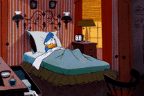 卡通的小鸭子早上被闹钟吵醒GIF图片